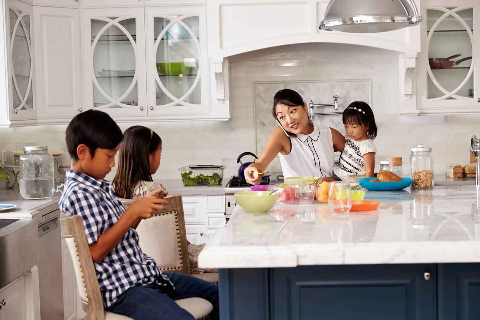 Busy but happy family in the kitchen