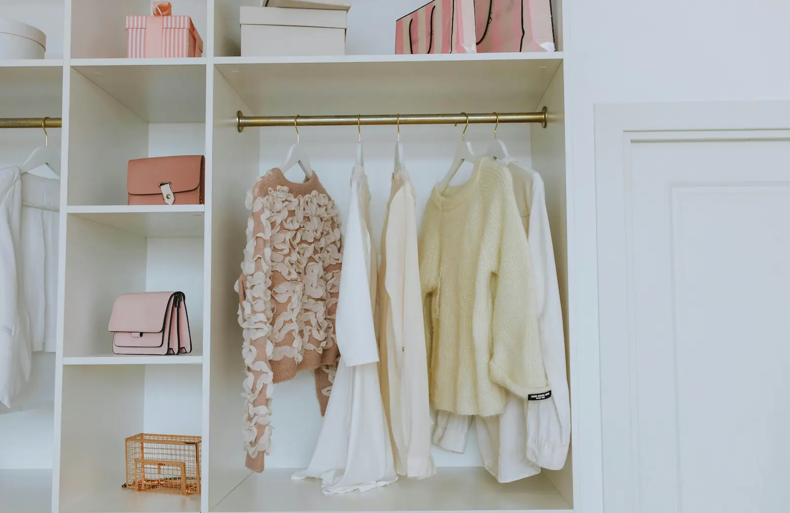 White Closet with sweaters and purses