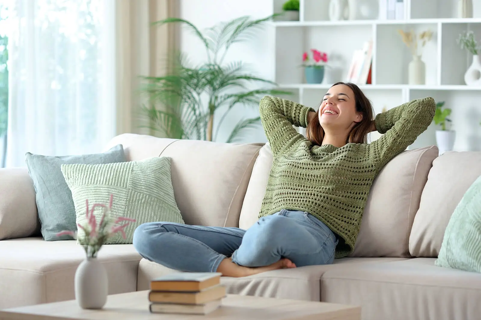 Relaxed woman in an open and bright room